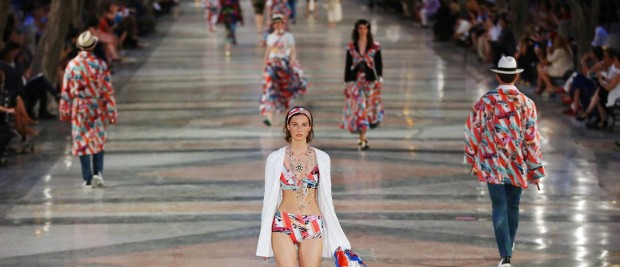 Models present creations by German designer Karl Lagerfeld as part of his latest inter-seasonal Cruise collection for fashion house Chanel at the Paseo del Prado street in Havana, Cuba