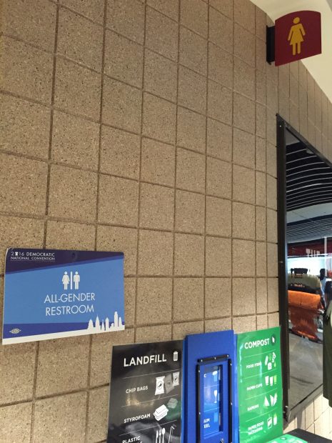 The special DNC all-gender restroom sign, juxtaposed against the regular women's restroom sign. [Blake Neff/Daily Caller News Foundation]