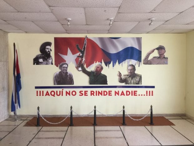 Leaders of the communist revolutuion are depicted on the wall at the Havana Ministry of Transportation. (Robert Donachie/ Daily Caller News Foundation)