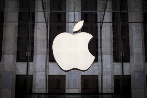 An Apple logo hangs above the entrance to the Apple store on 5th Avenue in New York City, in this file photo taken July 21, 2015. REUTERS/Mike Segar/Files