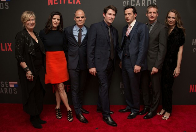 (L-R): Actors Jayne Atkinson, Neve Campbell, Michael Kelly, Derek Cecil, Nathan Darrow, Paul Sparks and Elizabeth Marvel pose on the red carpet at the season 4 premiere screening of Netflix show "House of Cards" in Washington, D.C. (Photo: NICHOLAS KAMM/AFP/Getty Images)