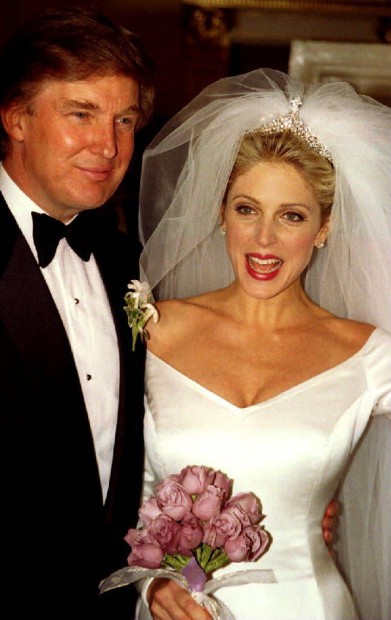 Donald Trump and Marla Maples appear in front of the press December 21, 1993 after marrying in a lavish and private wedding ceremony at Trump's Plaza Hotel in New York