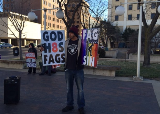 Member of Westboro Baptist Church protests outside of the GOP Caucus site in Wichita, Kan., March 5, 2016. 