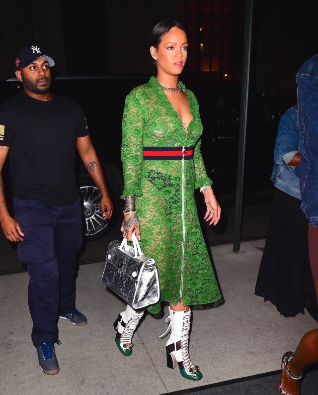 RihanRihanna na was spotted out in NYC on Wednesday night, wearing a $3500 Gucci SS16 Green Lace Dress. She left her bra at home, showing off her perfect figure , and her nipples , as she headed to the Edition Hotel. She finished her look with Gucci Boots, and her hair pulled back in a bun. She strutted confidently for the cameras , as a Taxi drove behind her, with an ad for Rumored flame, Drake's new album, "Views". Pictured: Rihanna Ref: SPL1291214 250516 Picture by: (photo: 247PAPS.TV / Splash News (photo:Splash News and Pictures