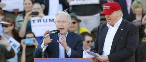 Senator Jeff Sessions speaks next to Republican presidential candidate Donald Trump at a rally at Madison City Schools Stadium in Madison, Alabama February 28, 2016