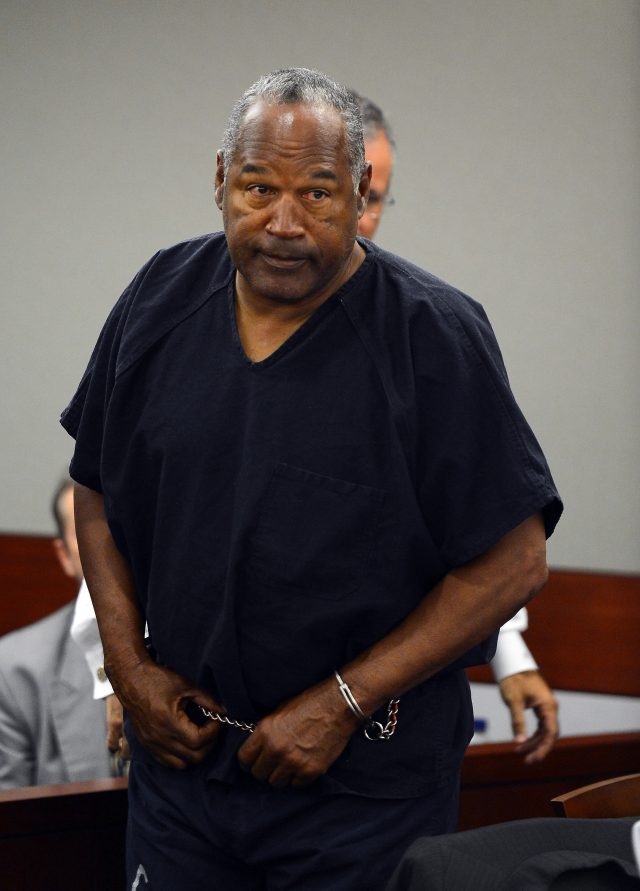 LAS VEGAS, NV - MAY 17: O.J. Simpson enters the courtroom at an evidentiary hearing in Clark County District Court on May 17, 2013 in Las Vegas, Nevada. Simpson, who is currently serving a nine-to-33-year sentence in state prison as a result of his October 2008 conviction for armed robbery and kidnapping charges, is using a writ of habeas corpus to seek a new trial, claiming he had such bad representation that his conviction should be reversed. (Photo by Ethan Miller/Getty Images)