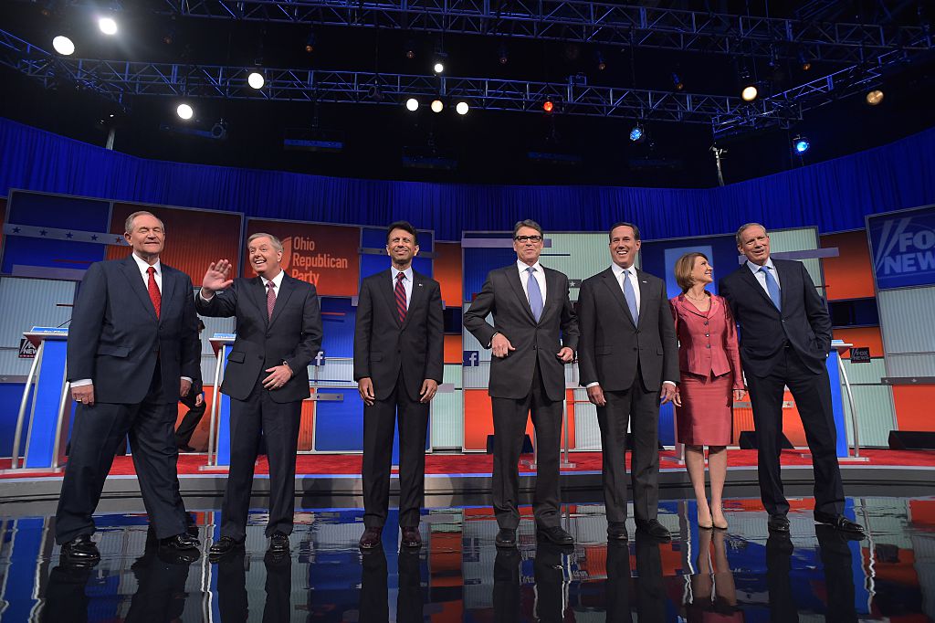 Republican presidential hopefuls (L-R) Jim Gilmore, Lindsey Graham, Bobby Jindal, Rick Perry, Rick Santorum, Carly Fiorina and George Pataki on stage for the start of the Republican undercard primary debate (Getty Images)