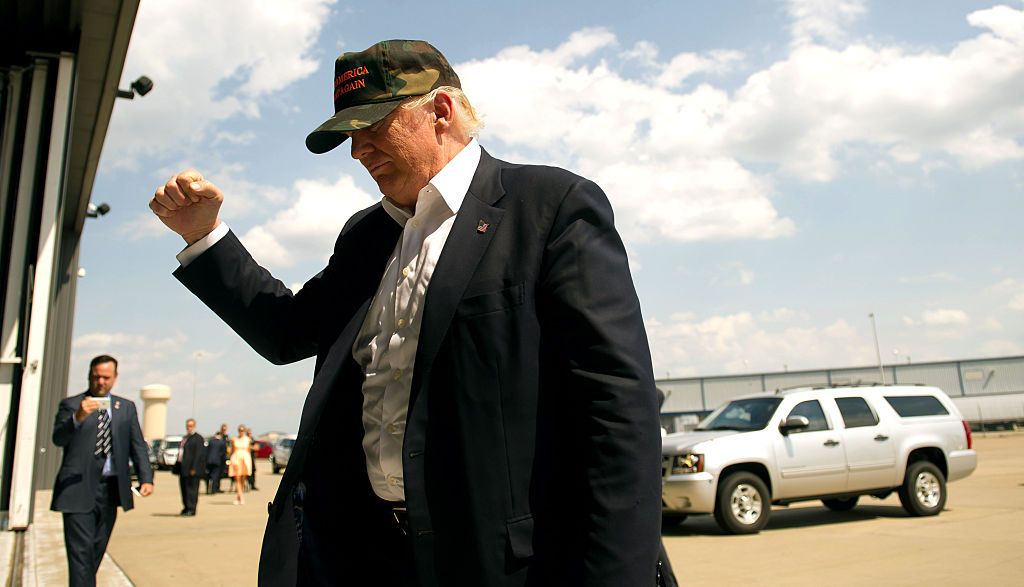 Donald Trump walks from his plane to speak to supporters at a rally on June 11, 2016 (Getty Images)
