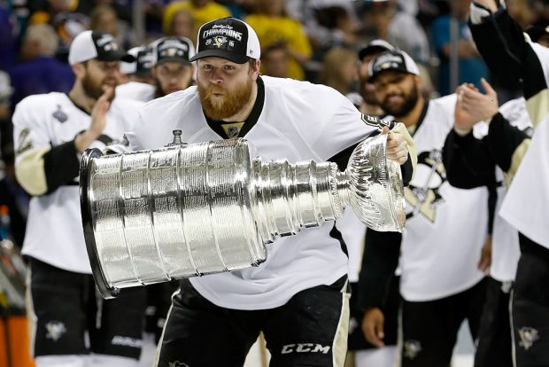 SAN JOSE, CA - JUNE 12: Phil Kessel #81 of the Pittsburgh Penguins celebrates with the Stanley Cup after their 3-1 victory to win the Stanley Cup against the San Jose Sharks in Game Six of the 2016 NHL Stanley Cup Final at SAP Center on June 12, 2016 in San Jose, California. (Photo by Christian Petersen/Getty Images)