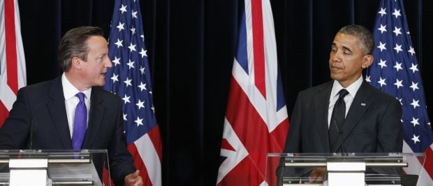U.S. President Barack Obama reacts to a witty comment from British Prime Minister David Cameron during a news conference at the G7 Summit in Brussels June 5, 2014. The summit of the major economic powers had originally been planned for Sochi in?Russia?until Moscow was suspended from the group - then the G8 - over the Ukraine crisis. REUTERS/Kevin Lamarque (BELGIUM - Tags: POLITICS BUSINESS TPX IMAGES OF THE DAY) - RTR3SD9Z