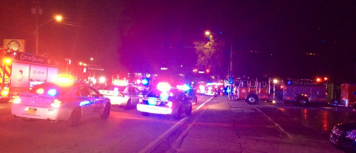 Police cars and fire trucks are seen outside the Pulse night club where police said a suspected gunman left multiple people dead and injured in Orlando, Florida, June 12, 2016. Orlando Police Department/Handout via REUTERS