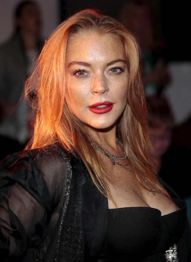 Actress Lindsay Lohan arrives for the presentation of the Gareth Pugh Spring/Summer 2016 collection during London Fashion Week in London, Britain September 19, 2015. REUTERS/Suzanne Plunkett - RTS1X1J