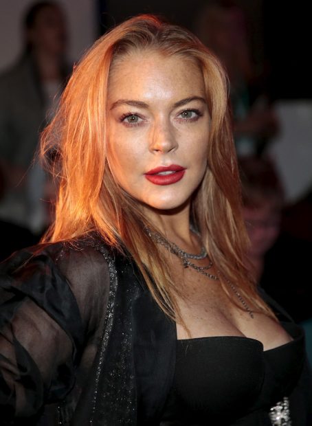 Actress Lindsay Lohan arrives for the presentation of the Gareth Pugh Spring/Summer 2016 collection during London Fashion Week in London, Britain September 19, 2015. REUTERS/Suzanne Plunkett - RTS1X1J