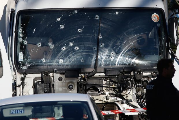Bullet imacts are seen on the heavy truck the day after it ran into a crowd at high speed killing scores celebrating the Bastille Day July 14 national holiday on the Promenade des Anglais in Nice, France, July 15, 2016. (REUTERS/Eric Gaillard)