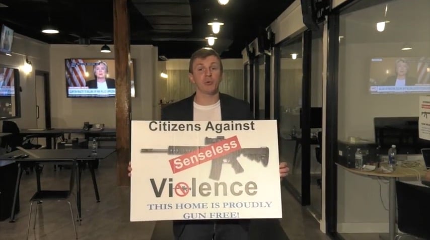 James O'Keefe holds a CASV sign (Project Veritas)