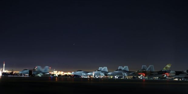 An F-22 Raptor taxis toward the runway prior to flying a Red Flag 15-1 training mission Feb. 4, 2015, at Nellis Air Force Base, Nev. Night missions have been integrated into Red Flag to prepare aircrews for missions in low-light environments. The F-22 is assigned to the 94th Fighter Squadron at Joint Base Langley-Eustis, Va. (U.S. Air Force photo/Airman 1st Class Mikaley Towle)