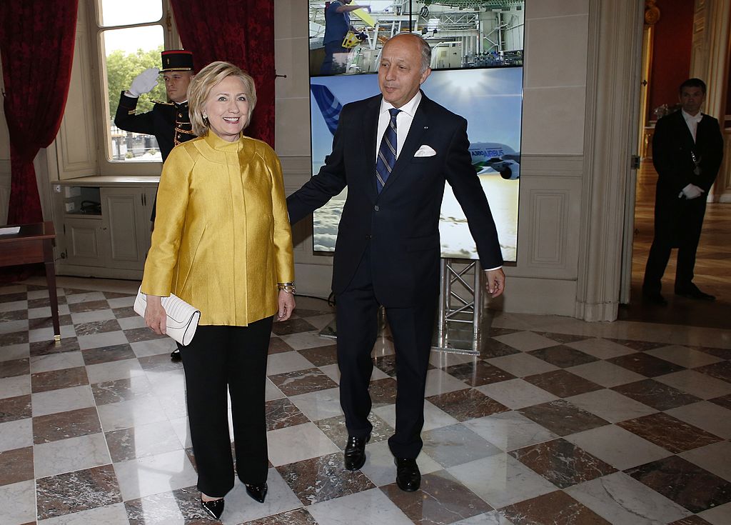 Hillary Clinton (L) is welcomed by French Foreign Minister Laurent Fabius during a visit to Paris (Getty Images)