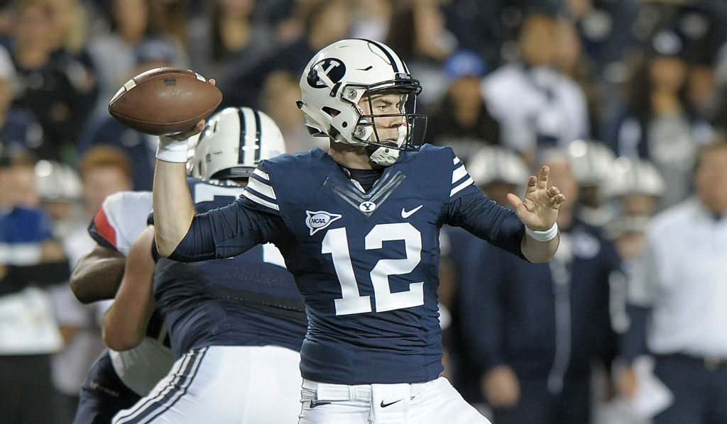 Quarterback Tanner Mangum of the Brigham Young Cougars throws a pass during their game against the Connecticut Huskies at LaVell Edwards Stadium on October 2, 2015 (Getty Images)