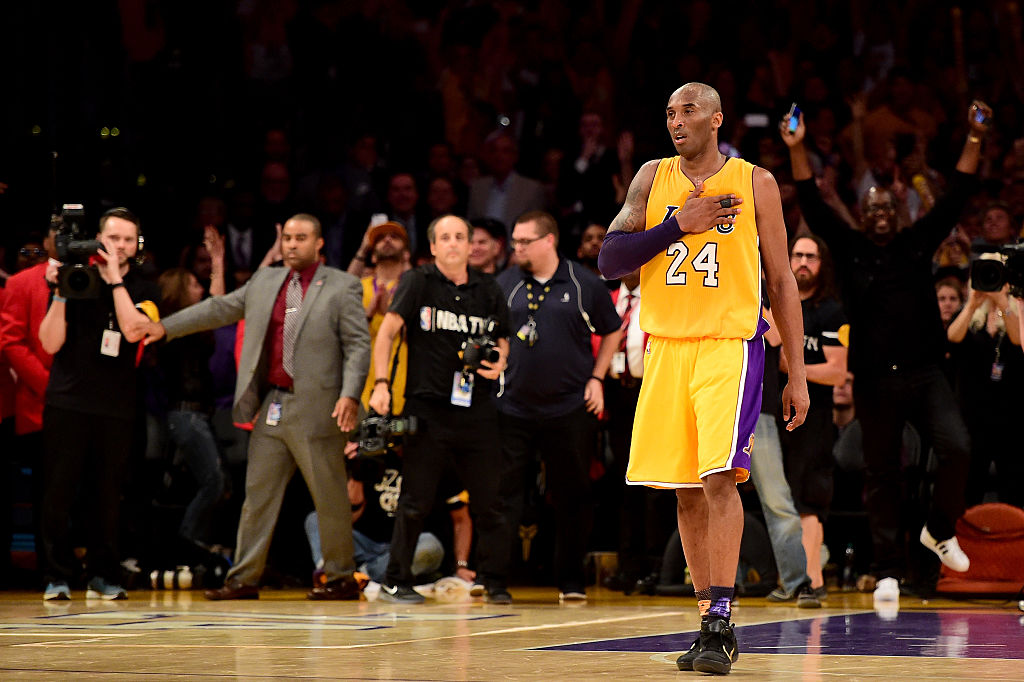 LOS ANGELES, CA - APRIL 13: Kobe Bryant #24 of the Los Angeles Lakers waves to the crowd as he is taken out of the game after scoring 60 points against the Utah Jazz at Staples Center on April 13, 2016 in Los Angeles, California.(Photo by Harry How/Getty Images)