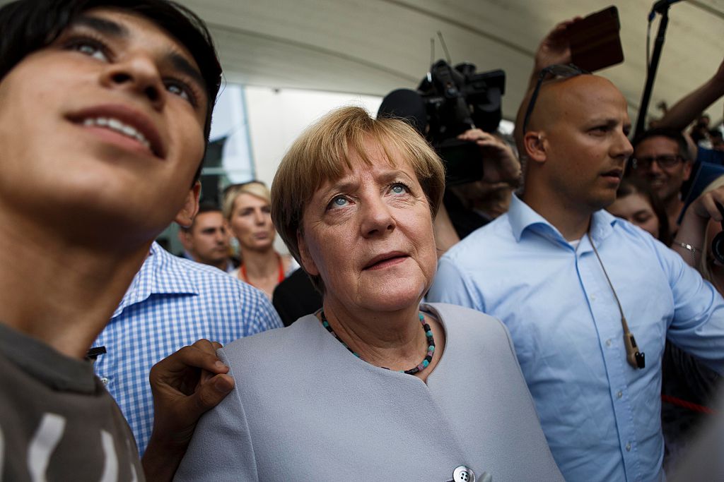  A visitor takes a selfie with German Chancellor Angela Merkel during the annual open-house day on August 28, 2016 in Berlin, Germany (Getty Images)