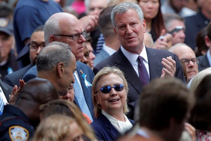 U.S. Democratic presidential candidate Hillary Clinton and New York Mayor Bill de Blasio (R) attend ceremonies to mark the 15th anniversary of the September 11 attacks at the National 9/11 Memorial in New York, New York, United States September 11, 2016. REUTERS/Brian Snyder