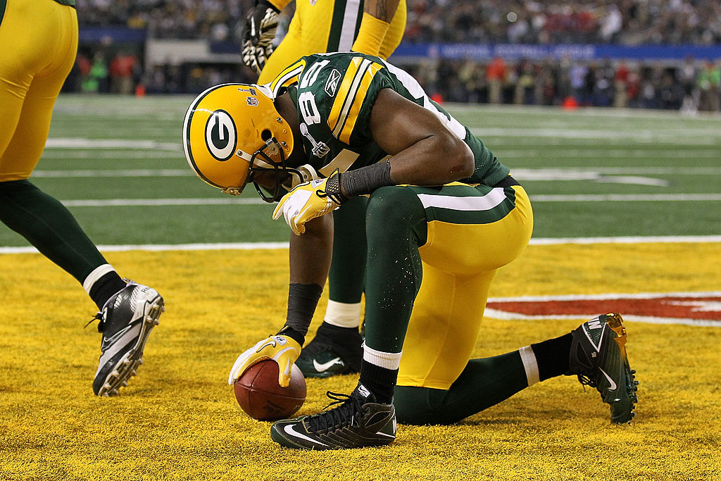 ARLINGTON, TX - FEBRUARY 06: Greg Jennings #85 of the Green Bay Packers reacts after catching a 21 yard touchdown against the Pittsburgh Steelers during Super Bowl XLV at Cowboys Stadium on February 6, 2011 in Arlington, Texas. (Photo by Al Bello/Getty Images)