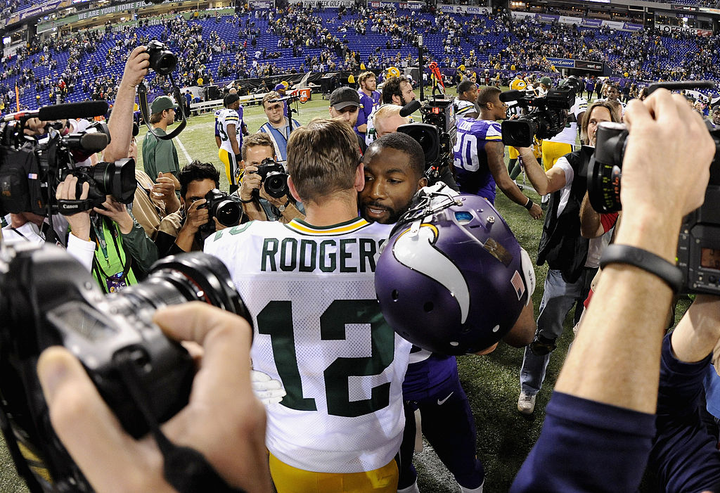 MINNEAPOLIS, MN - OCTOBER 27: Aaron Rodgers #12 of the Green Bay Packers and Greg Jennings #15 of the Minnesota Vikings speak after the game on October 27, 2013 at Mall of America Field at the Hubert H. Humphrey Metrodome in Minneapolis, Minnesota. The Packers defeated the Vikings 44-31. (Photo by Hannah Foslien/Getty Images)