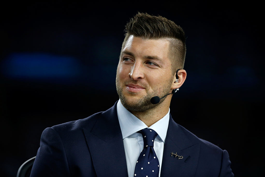 ARLINGTON, TX - DECEMBER 31: Broadcaster Tim Tebow of the SEC Network speaks on air before the Goodyear Cotton Bowl at AT&T Stadium on December 31, 2015 in Arlington, Texas. (Photo by Scott Halleran/Getty Images)