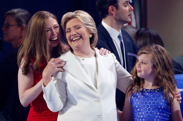 A Clinton look-alike hugs Chelsea Clinton onstage at the Democratic National Convention. (Photo: Getty Images)