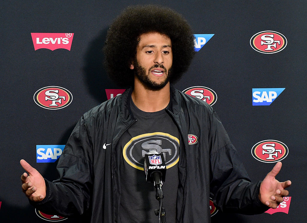 Kaepernick speaks at a post game press conference. (Photo by Harry How/Getty Images)
