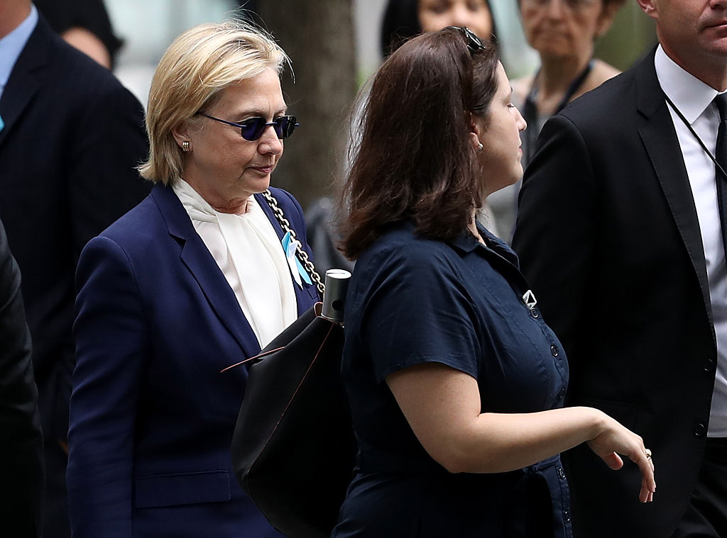 Hillary Clinton arrives with an unidentified woman at the September 11 Commemoration Ceremony at the National September 11 Memorial (Getty Images)