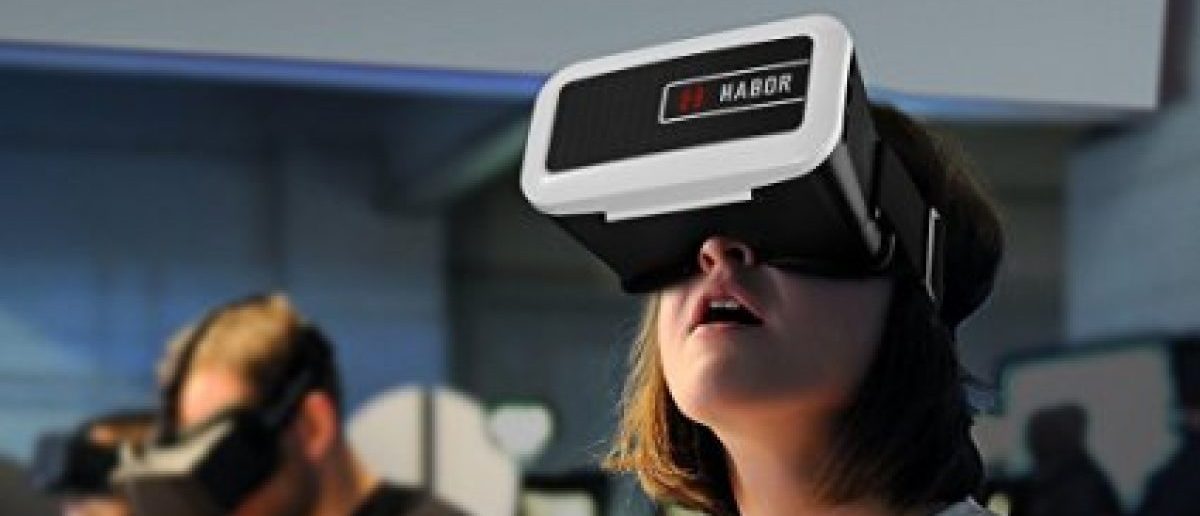 This girl seems amazed at the virtual reality (Photo via Amazon)