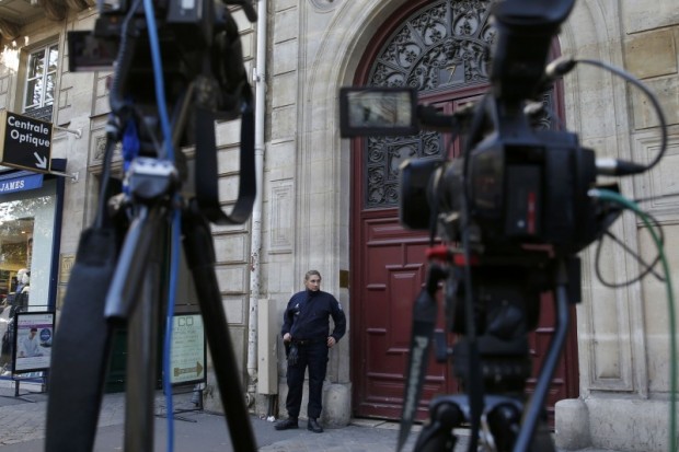 A police officer stands guard at the entrance of a luxury residence on the Rue Tronchet in central Paris, France, October 3, 2016 where masked men robbed U.S. reality TV star Kim Kardashian West at gunpoint early on Monday, stealing jewellery worth millions of dollars, police and her publicist said. REUTERS/Gonzalo Fuentes