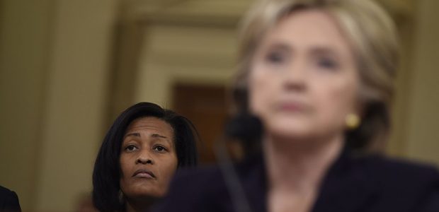 Cheryl Mills sits behind Hillary Clinton as the former secretary of state testifies before Congress in 2015 (Getty Images)