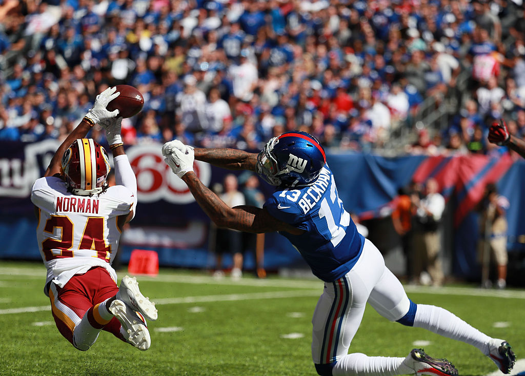 Josh Norman #24 of the Washington Redskins breaks up a pass to Odell Beckham #13 of the New York Giants (Photo by Michael Reaves/Getty Images)