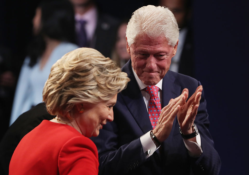 Hillary Clinton looks on with husband and former U.S. President Bill Clinton after the First Presidential Debate (Getty Images)