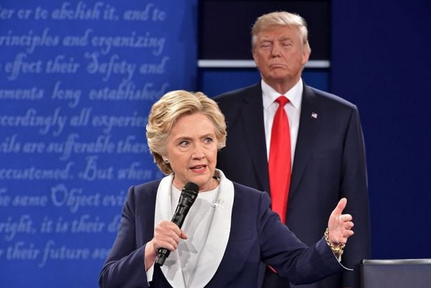 Republican presidential candidate Donald Trump listens to Democratic presidential candidate Hillary Clinton during the second presidential debate at Washington University in St. Louis, Missouri on October 9, 2016. (PAUL J. RICHARDS/AFP/Getty Images)