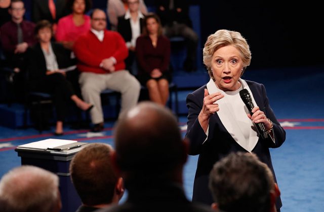 Democratic presidential nominee former Secretary of State Hillary Clinton responds to a question during the town hall debate at Washington University on October 9, 2016 in St Louis, Missouri