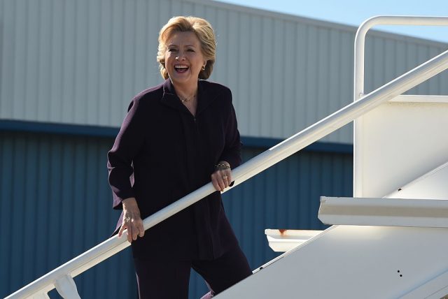 Democrat presidential nominee Hillary Clinton boards her campaign plane in White Plains, New York October 10,2016 as she departs for a campaign event in Detroit, Michigan