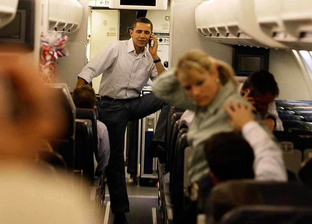 CHICAGO, IL- MAY 07: Democratic presidential hopeful Sen. Barack Obama (D-IL) talks on his cell phone as he boards his campaign plane at Midway Airport en-route to Washington DC, May 7, 2008 in Chicago, Illinois. (Getty Images)