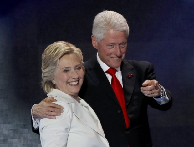U.S. Democratic presidential nominee Hillary Clinton stands with her husband, former President Bill Clinton, after accepting the nomination on the final night of the Democratic National Convention in Philadelphia, Pennsylvania, U.S. July 28, 2016. REUTERS/Mike Segar/File Photo 