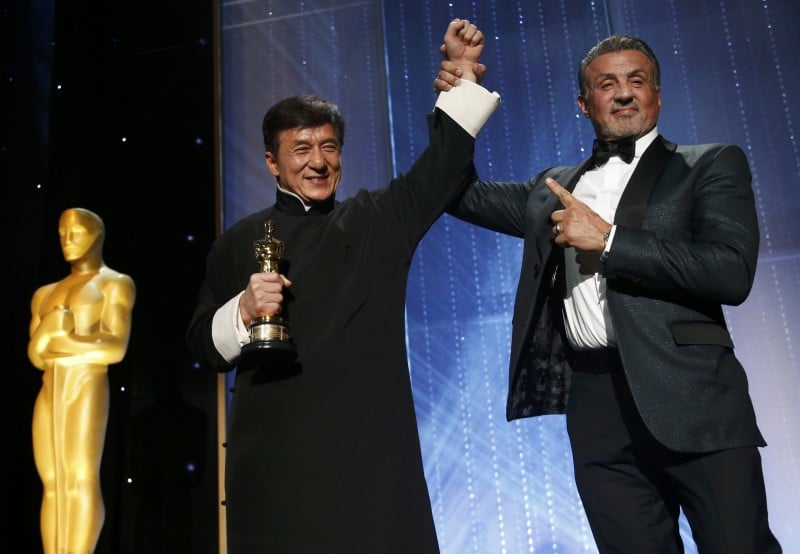 Actor Jackie Chan is congratulated by fellow actor Sylvester Stallone (R) after accepting his Honorary Award at the 8th Annual Governors Awards in Los Angeles, California, U.S., November 12, 2016. REUTERS/Mario Anzuoni
