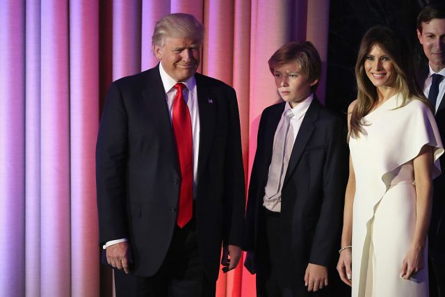 Republican president-elect Donald Trump acknowledges the crowd along with his son Barron Trump, and wife Melania Trump during his election night event at the New York Hilton Midtown in the early morning hours of November 9, 2016 in New York City. Donald Trump defeated Democratic presidential nominee Hillary Clinton to become the 45th president of the United States. (Photo by Joe Raedle/Getty Images)