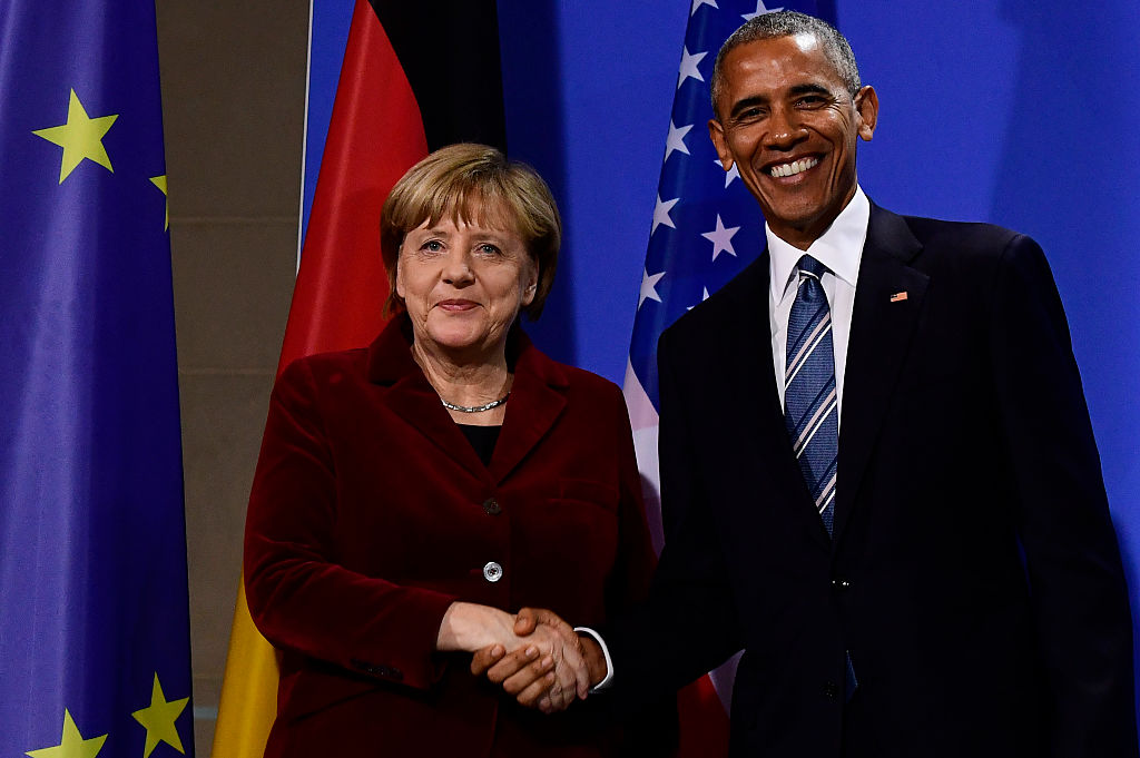 President Barack Obama and German Chancellor Angela Merkel shake hands after addressing the press in Berlin on November 17, 2016 (Getty Images)