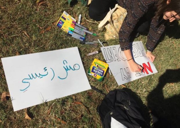 Protesters write "not my president" in several languages