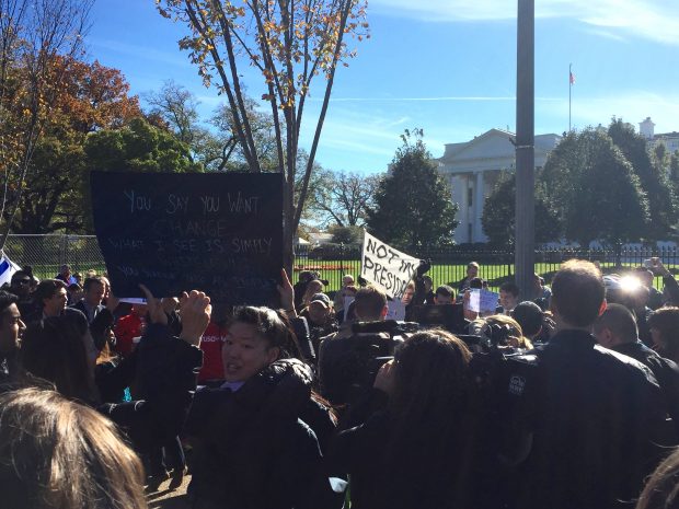 Protesters decry 'whitelash' outside of White House. 