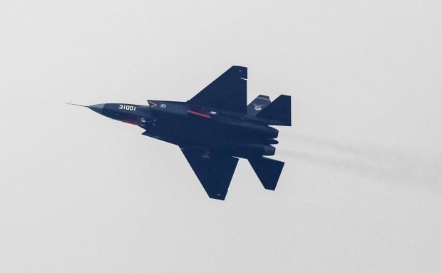 A J-31 stealth fighter of the Chinese People's Liberation Army Air Force is seen during a test flight ahead of the 10th China International Aviation and Aerospace Exhibition in Zhuhai, Guangdong province, November 10, 2014. More than 130 planes will attend the six-day air show starting on Tuesday, Xinhua News Agency reported. REUTERS/Alex Lee