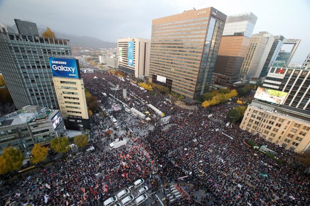 People take part in a rally calling for President Park Geun-hye to step down in central Seoul, South Korea, November 12, 2016. REUTERS/Kim Hong-Ji