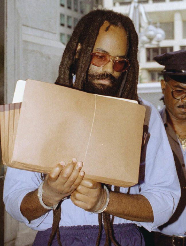 A federal judge overturned the death sentence of former Black Panther and radio journalist Mumia Abu-Jamal December 18, 2001, ordering a new sentencing hearing for the convicted killer of a Philadelphia police officer whose case has been championed by death-penalty opponents worldwide. REUTERS/Steven M. Falk/Files