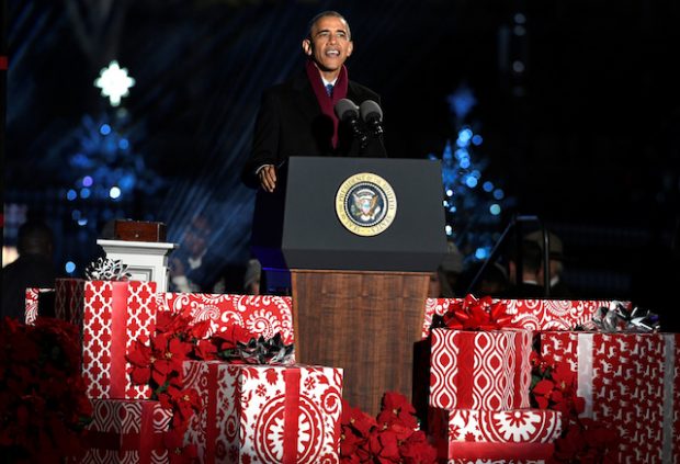 U.S. President Barack Obama, surrounded by Christmas gifts, makes remarks at the 94th Annual National Christmas Tree Lighting ceremony on The Ellipse, near the White House, in Washington, U.S., December 1, 2016. REUTERS/Mike Theiler - RTSUA3Z